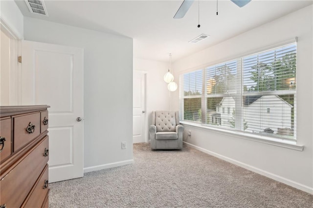 6360 Boulder Rdg, Cumming, GA 30028 - sitting room with healthy amount of natural light, baseboards, ceiling fan, and light colored carpet