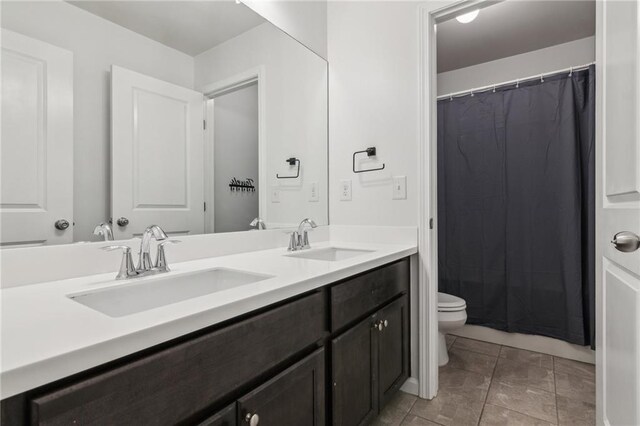 6360 Boulder Rdg, Cumming, GA 30028 - full bathroom featuring toilet, double vanity, tile patterned floors, and a shower with curtain