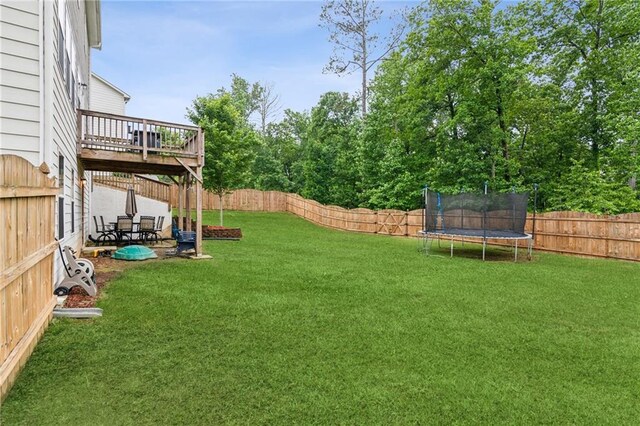 6360 Boulder Rdg, Cumming, GA 30028 - view of yard with a trampoline and a deck