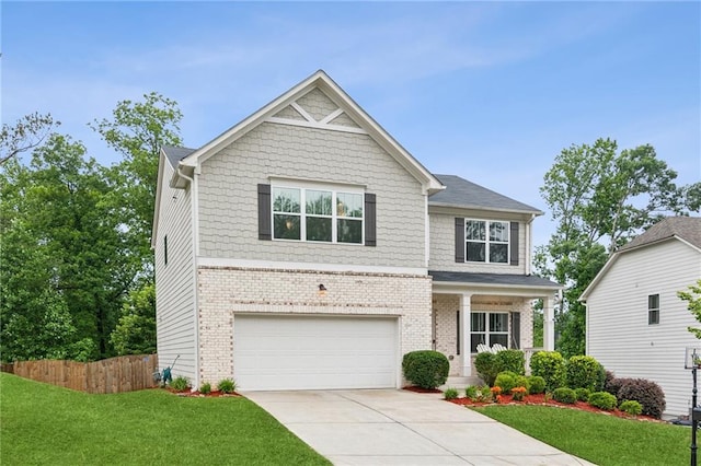 6360 Boulder Rdg, Cumming, GA 30028 - craftsman house featuring driveway, a garage, brick siding, and covered porch
