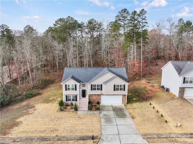 view of front of house with a garage and a front lawn