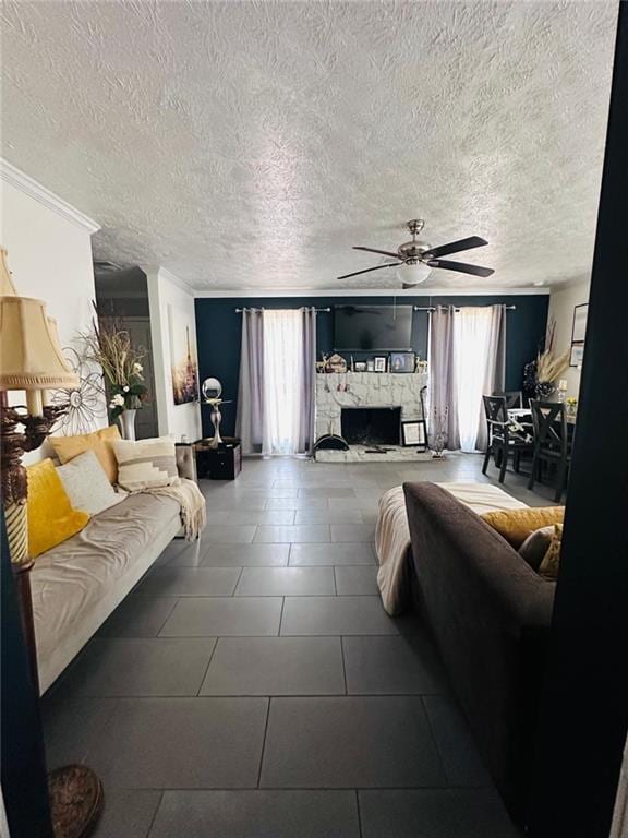 4312 Idlewood Ln, Tucker, GA 30084 - tiled living room with a ceiling fan, healthy amount of natural light, a fireplace, a textured ceiling, and ornamental molding