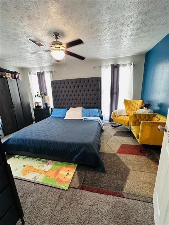 4312 Idlewood Ln, Tucker, GA 30084 - bedroom featuring multiple windows, a ceiling fan, a textured ceiling, and carpet