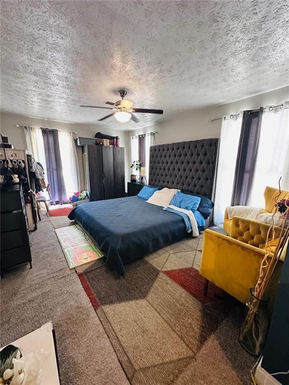 4312 Idlewood Ln, Tucker, GA 30084 - bedroom featuring carpet floors, a textured ceiling, and a ceiling fan