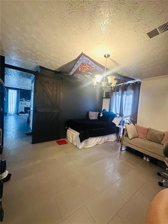 4312 Idlewood Ln, Tucker, GA 30084 - bedroom with a textured ceiling, a chandelier, multiple windows, and a barn door