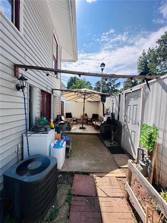4312 Idlewood Ln, Tucker, GA 30084 - fenced backyard with central AC unit and a patio area