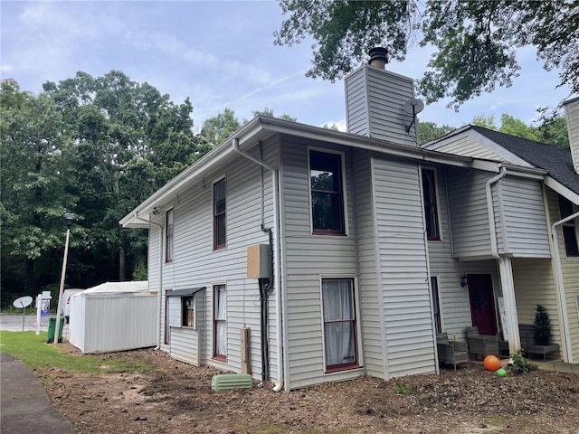 4312 Idlewood Ln, Tucker, GA 30084 - view of property exterior with a chimney