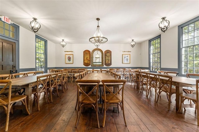 dining area featuring plenty of natural light and dark hardwood / wood-style floors