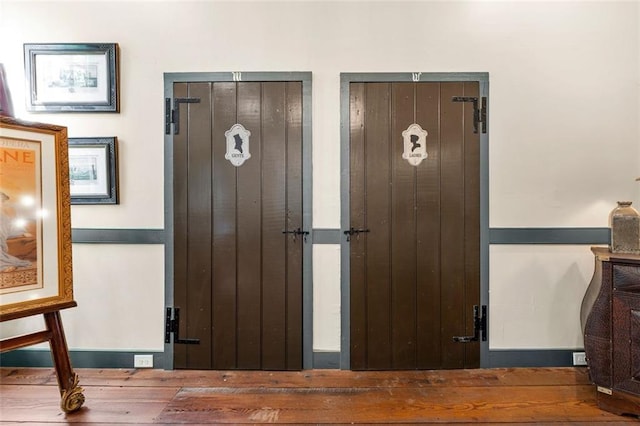 interior space featuring dark hardwood / wood-style flooring and a notable chandelier