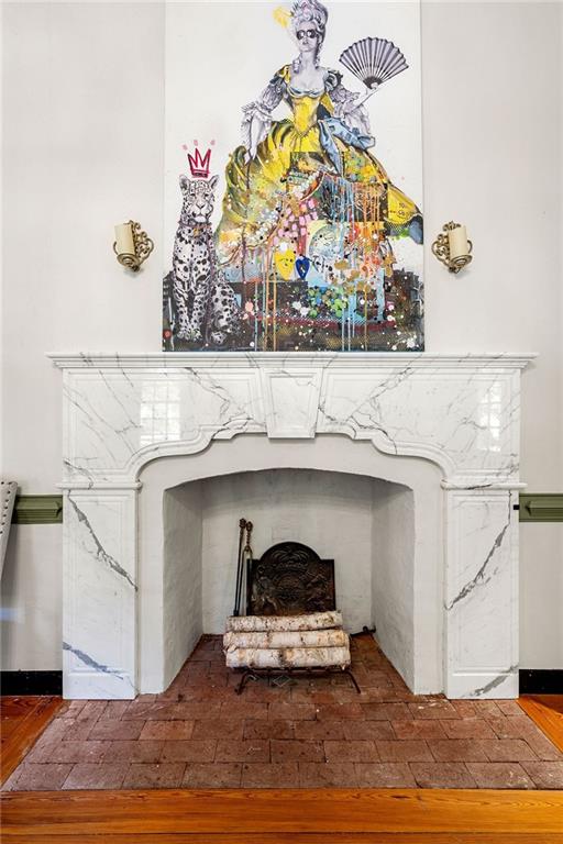 dining room featuring a chandelier, wood-type flooring, plenty of natural light, and ornamental molding