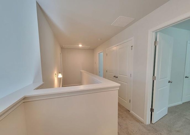15 Fontana Ct, Covington, GA 30016 - corridor with light colored carpet, baseboards, and an upstairs landing