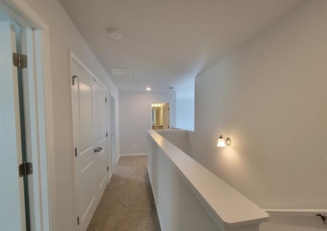 15 Fontana Ct, Covington, GA 30016 - hallway with an upstairs landing, light carpet, baseboards, and recessed lighting