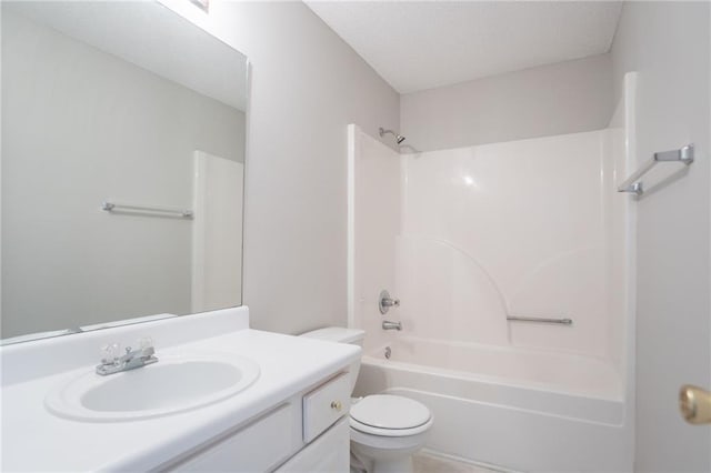 bathroom with toilet, vanity, and shower / bath combination