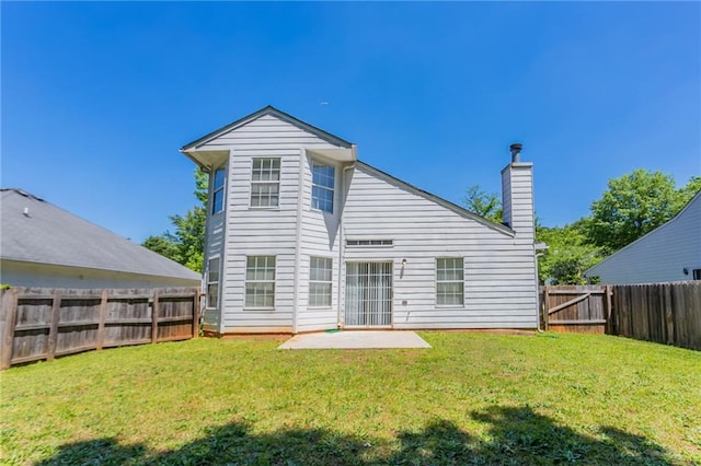 rear view of property with a patio and a chimney