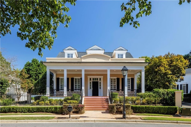 neoclassical home featuring covered porch