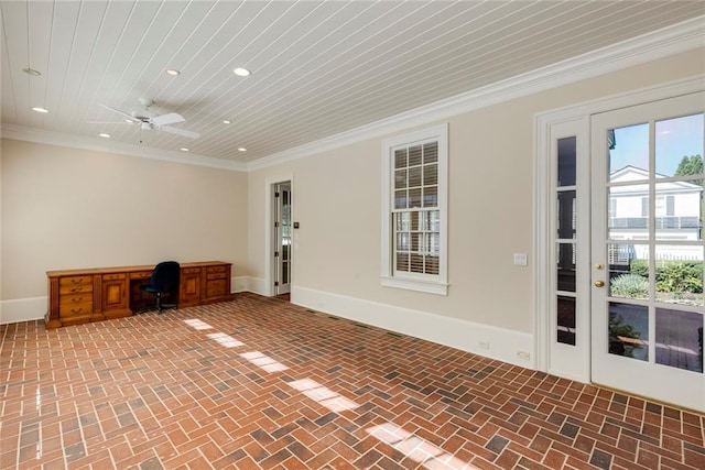 interior space featuring ceiling fan, built in desk, crown molding, and wooden ceiling