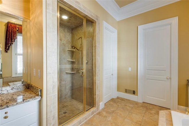 bathroom with plus walk in shower, crown molding, tile patterned floors, and vanity