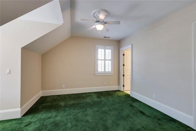 bonus room with lofted ceiling, dark colored carpet, and ceiling fan