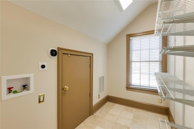 laundry room featuring hookup for an electric dryer, a skylight, and hookup for a washing machine