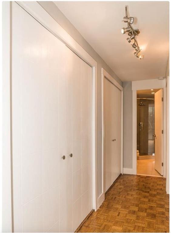 corridor with parquet flooring