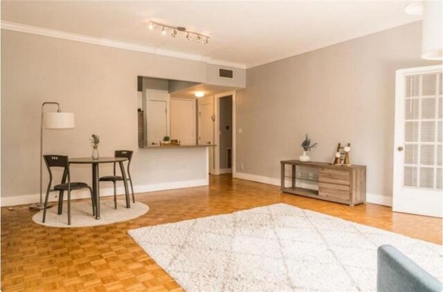 living area featuring parquet floors and ornamental molding