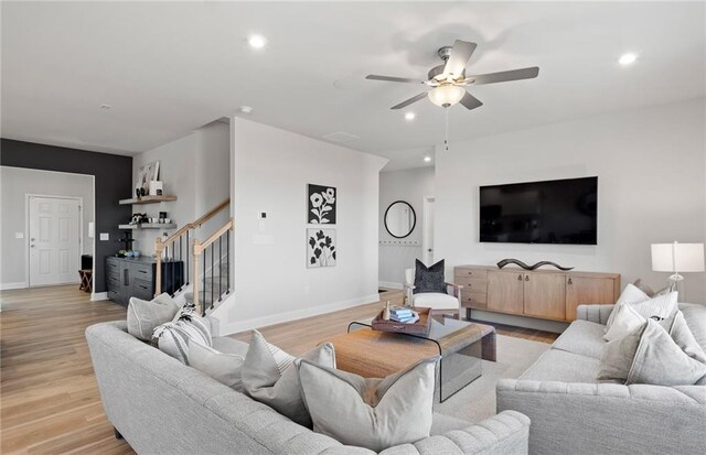 living area featuring recessed lighting, stairs, light wood-type flooring, and ceiling fan