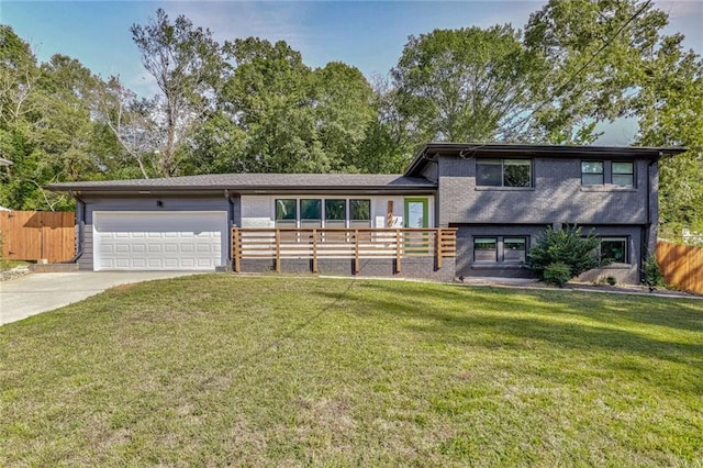 split level home featuring a front yard and a garage