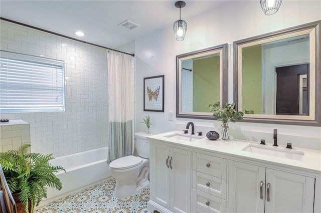 full bathroom with toilet, shower / bath combo, vanity, and tile patterned floors