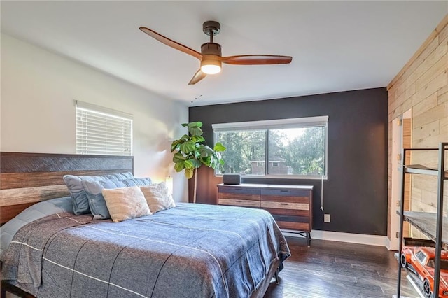 bedroom featuring dark wood-type flooring and ceiling fan