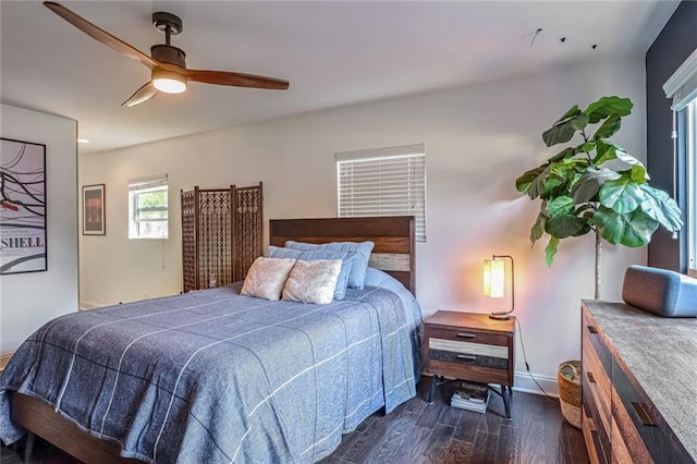 bedroom featuring dark hardwood / wood-style floors and ceiling fan