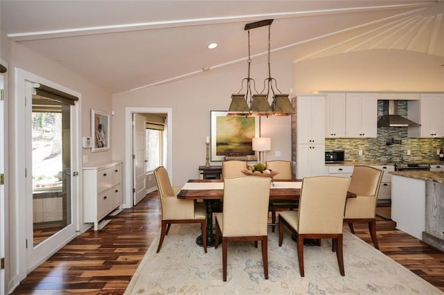 dining space with dark wood-type flooring, recessed lighting, and vaulted ceiling