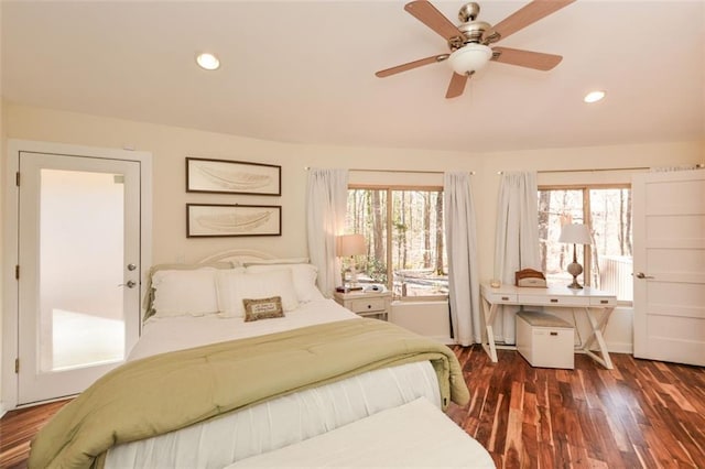 bedroom featuring dark wood-style floors, recessed lighting, and multiple windows