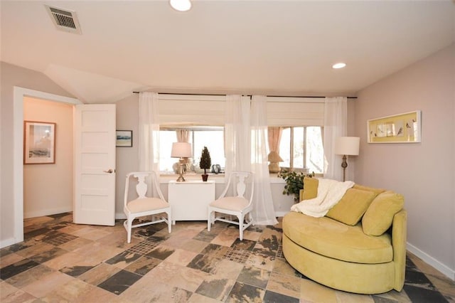 living area featuring recessed lighting, visible vents, vaulted ceiling, and baseboards