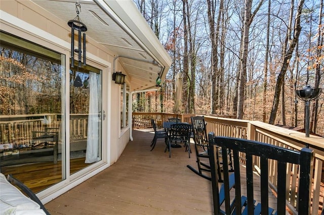 deck with outdoor dining area