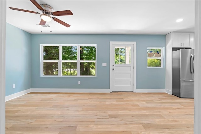 5233 Groovers Landing Rd SE, Acworth, GA 30101 - unfurnished living room with ceiling fan, light wood-type flooring, and recessed lighting
