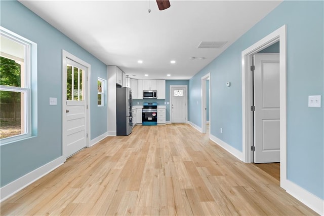 5233 Groovers Landing Rd SE, Acworth, GA 30101 - kitchen featuring stainless steel appliances, white cabinetry, light wood-type flooring, ceiling fan, and recessed lighting