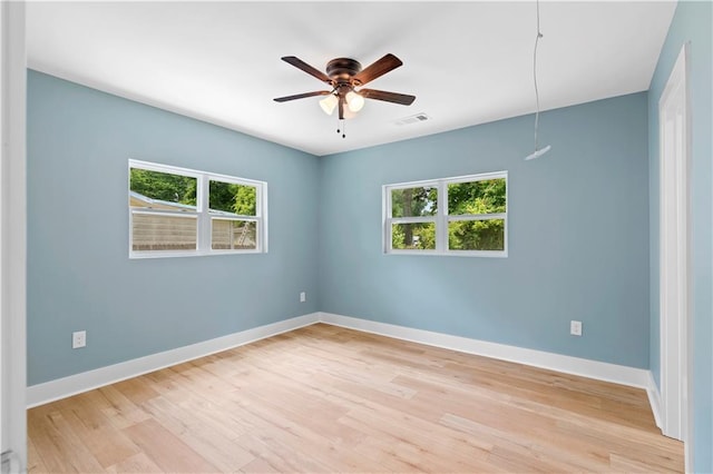 5233 Groovers Landing Rd SE, Acworth, GA 30101 - empty room with plenty of natural light, light wood-style flooring, and a ceiling fan