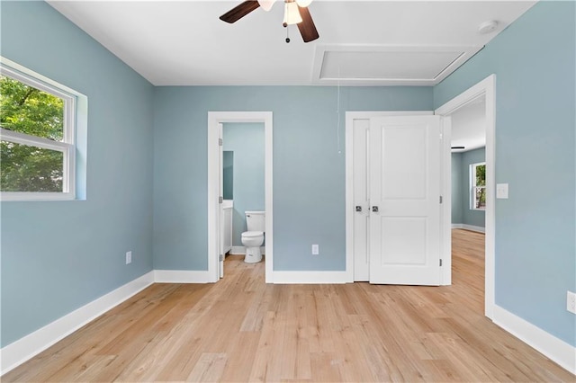 5233 Groovers Landing Rd SE, Acworth, GA 30101 - unfurnished bedroom with attic access, multiple windows, and light wood-style flooring