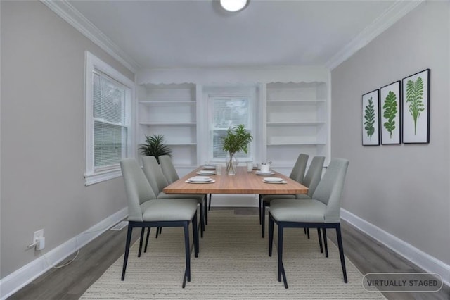 dining space featuring wood-type flooring, built in features, and crown molding