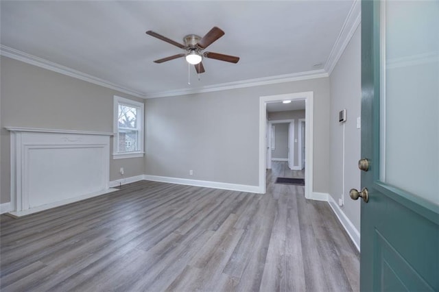 unfurnished living room featuring ceiling fan, ornamental molding, and light hardwood / wood-style flooring