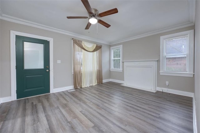 interior space featuring crown molding, light hardwood / wood-style flooring, and ceiling fan