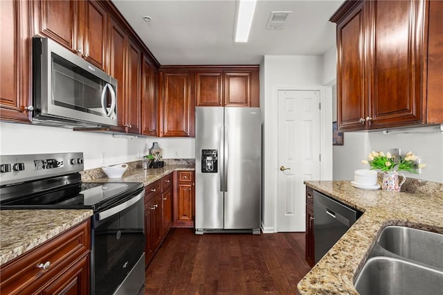 3334 Peachtree Rd NE Unit 1609, Atlanta, GA 30326 - kitchen with stainless steel appliances, dark wood finished floors, and light stone countertops
