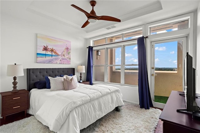 3334 Peachtree Rd NE Unit 1609, Atlanta, GA 30326 - bedroom with a raised ceiling, ceiling fan, and crown molding