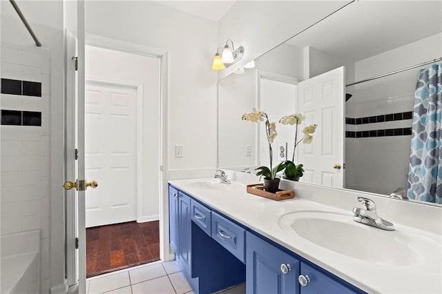 3334 Peachtree Rd NE Unit 1609, Atlanta, GA 30326 - full bath with double vanity, tile patterned flooring, and shower / tub combo