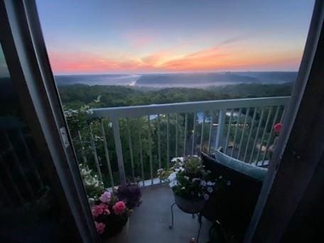 view of balcony at dusk