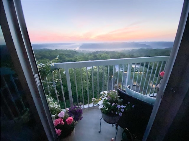 view of balcony at dusk