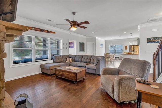 living room featuring sink, crown molding, ceiling fan with notable chandelier, and dark hardwood / wood-style floors