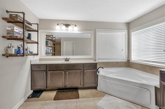 bathroom featuring vanity, a tub to relax in, and tile patterned floors