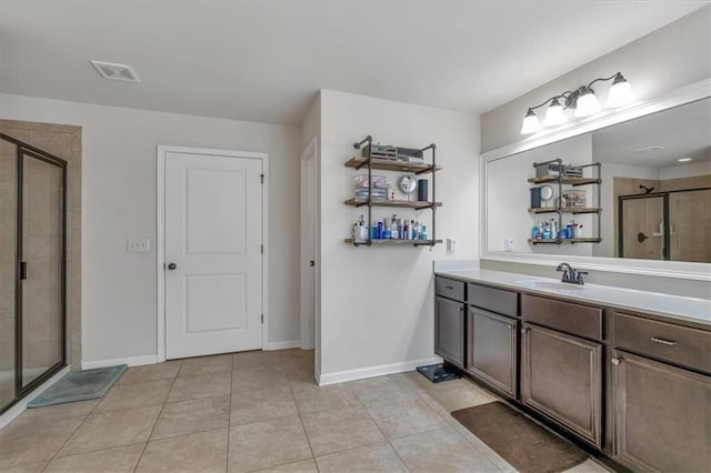 bathroom featuring walk in shower, tile patterned floors, and vanity