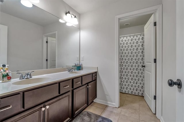 bathroom featuring tile patterned flooring, vanity, and a shower with shower curtain